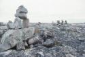 Niungvaliruluit (a window-shaped directional inuksuk for sighting or aligning a location in the…
